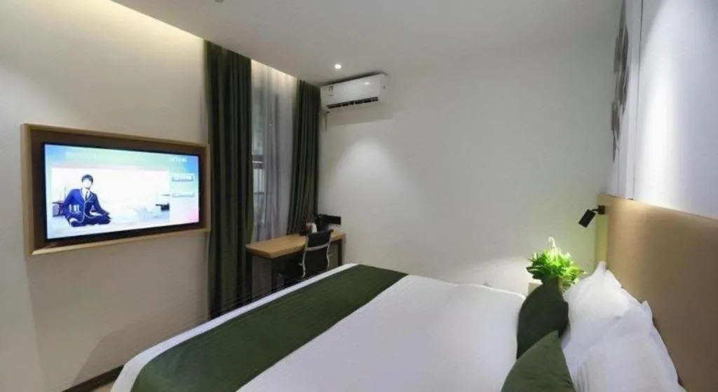 Bed in Green Tree Inn Guangxi Wuzhou 2nd Xinxing Road Liangguang Market