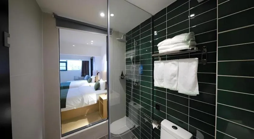 Bed in Green Tree Inn Guangxi Wuzhou 2nd Xinxing Road Liangguang Market