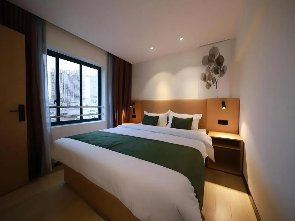 Bed in Green Tree Inn Guangxi Wuzhou 2nd Xinxing Road Liangguang Market