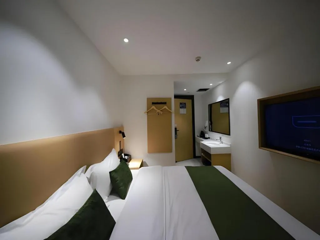 Bed in Green Tree Inn Guangxi Wuzhou 2nd Xinxing Road Liangguang Market