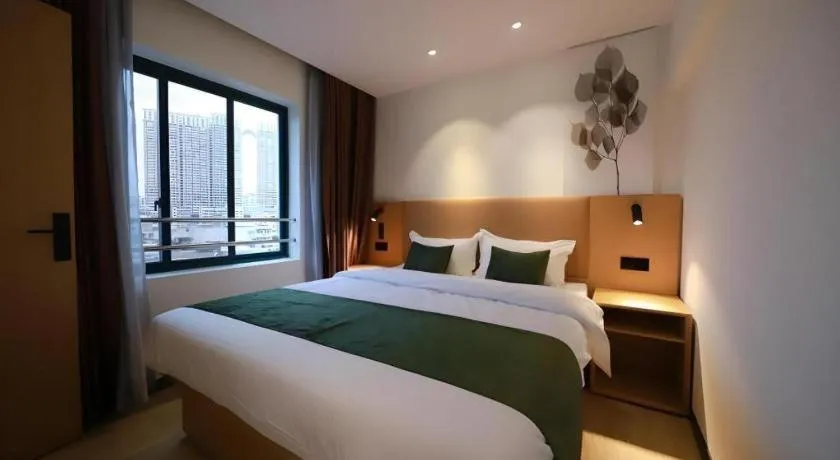 Bed in Green Tree Inn Guangxi Wuzhou 2nd Xinxing Road Liangguang Market