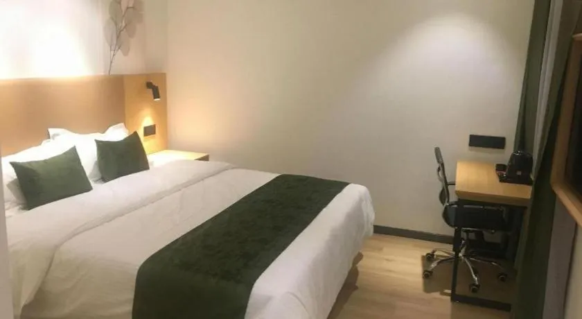 Bed in Green Tree Inn Guangxi Wuzhou 2nd Xinxing Road Liangguang Market
