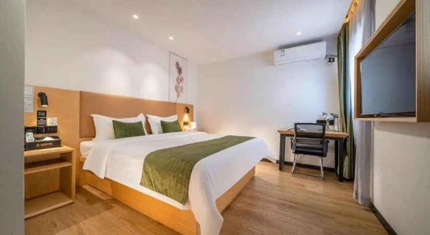 Bed in Green Tree Inn Guangxi Wuzhou 2nd Xinxing Road Liangguang Market