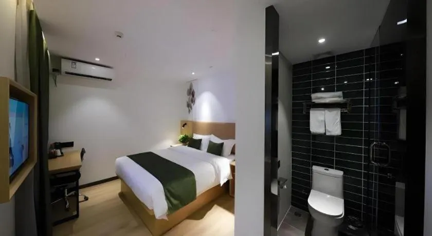 Bed in Green Tree Inn Guangxi Wuzhou 2nd Xinxing Road Liangguang Market