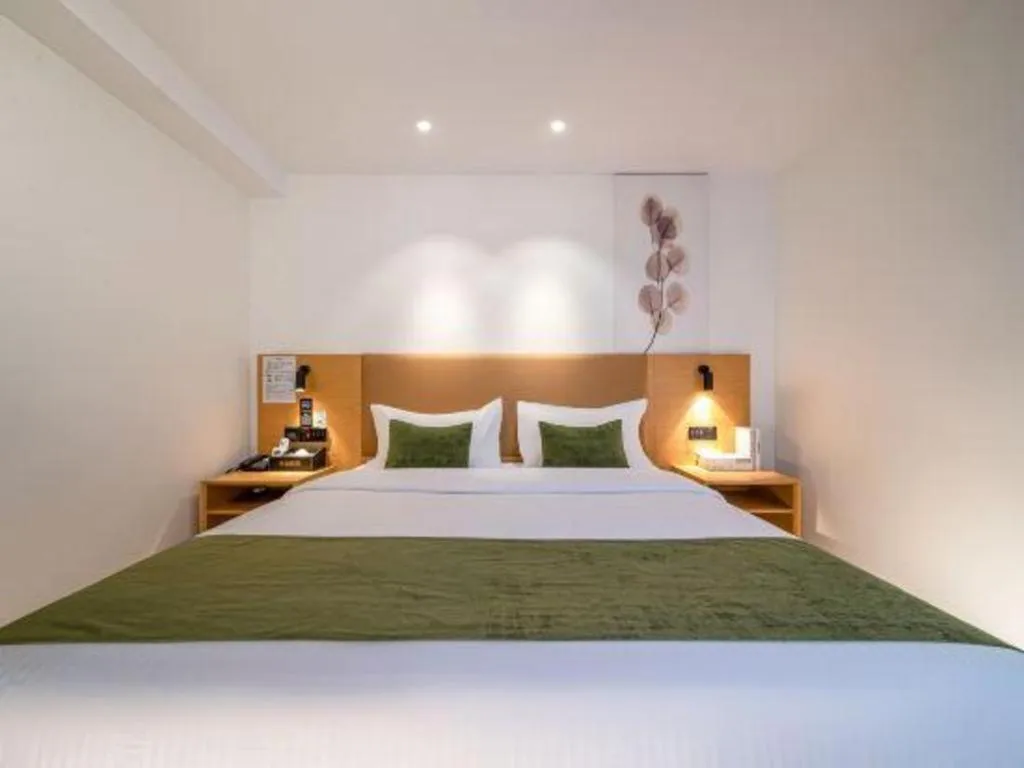 Bed in Green Tree Inn Guangxi Wuzhou 2nd Xinxing Road Liangguang Market