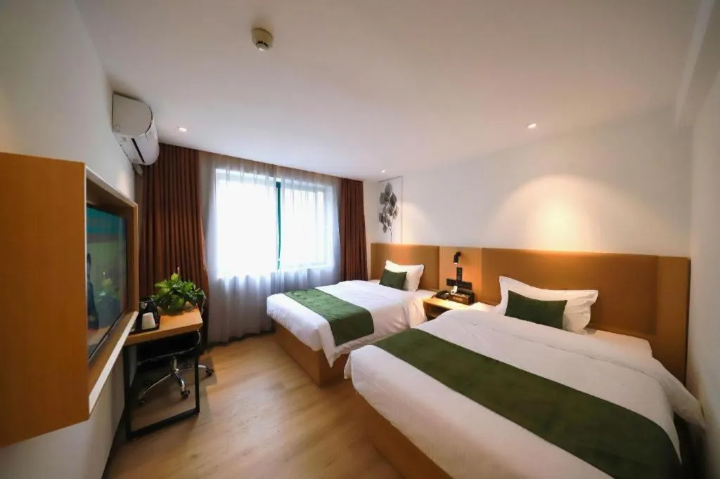 Bed in Green Tree Inn Guangxi Wuzhou 2nd Xinxing Road Liangguang Market