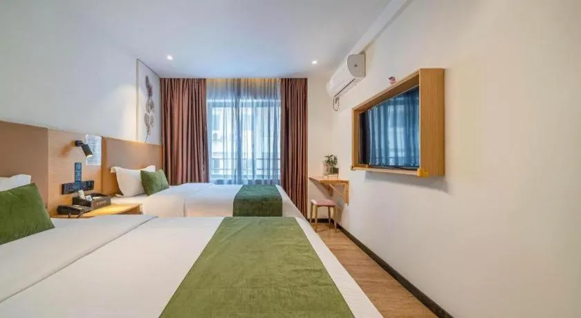 Bed in Green Tree Inn Guangxi Wuzhou 2nd Xinxing Road Liangguang Market
