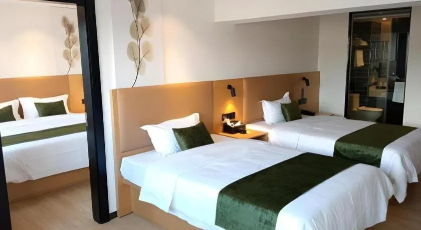 Bed in Green Tree Inn Guangxi Wuzhou 2nd Xinxing Road Liangguang Market