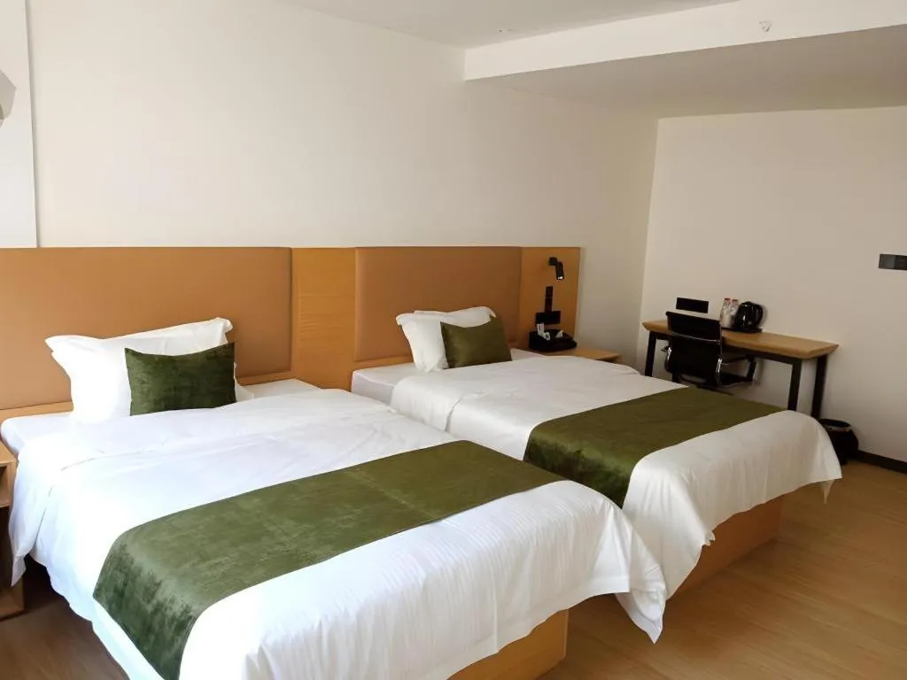 Bed in Green Tree Inn Guangxi Wuzhou 2nd Xinxing Road Liangguang Market