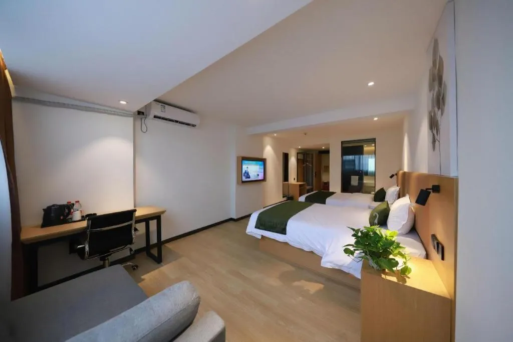 Bed in Green Tree Inn Guangxi Wuzhou 2nd Xinxing Road Liangguang Market