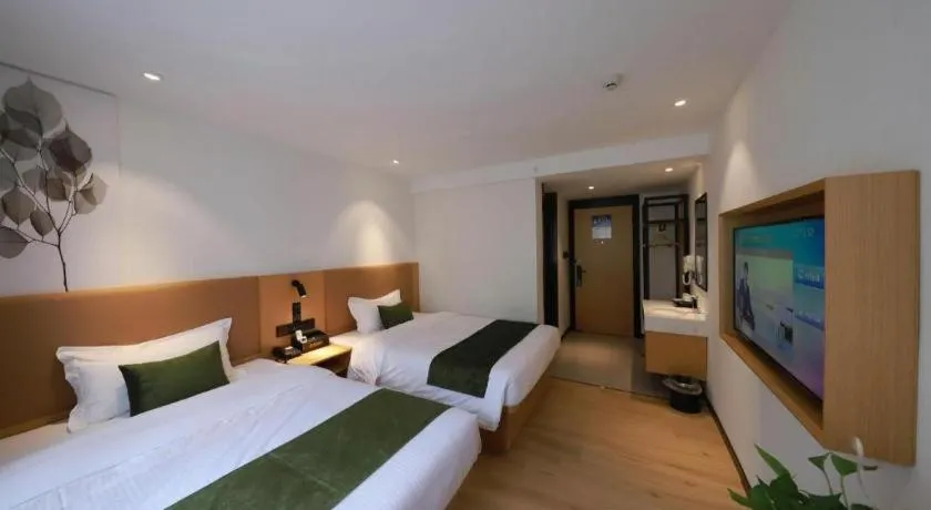 Bed in Green Tree Inn Guangxi Wuzhou 2nd Xinxing Road Liangguang Market