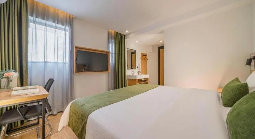 Bed in Green Tree Inn Guangxi Wuzhou 2nd Xinxing Road Liangguang Market