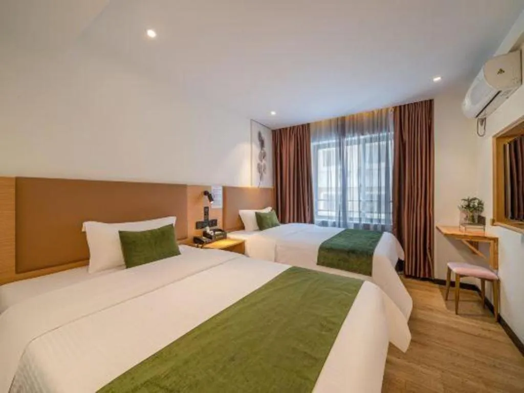 Bed in Green Tree Inn Guangxi Wuzhou 2nd Xinxing Road Liangguang Market