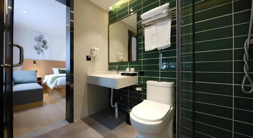 Bed in Green Tree Inn Guangxi Wuzhou 2nd Xinxing Road Liangguang Market