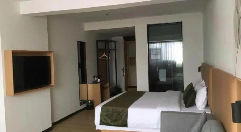 Bed in Green Tree Inn Guangxi Wuzhou 2nd Xinxing Road Liangguang Market