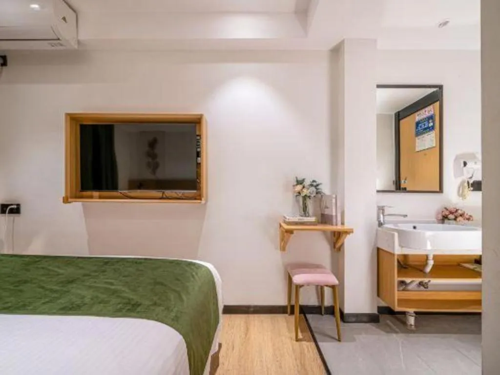 Bed in Green Tree Inn Guangxi Wuzhou 2nd Xinxing Road Liangguang Market