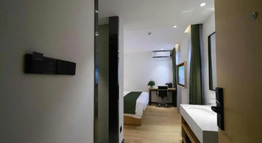 Bed in Green Tree Inn Guangxi Wuzhou 2nd Xinxing Road Liangguang Market