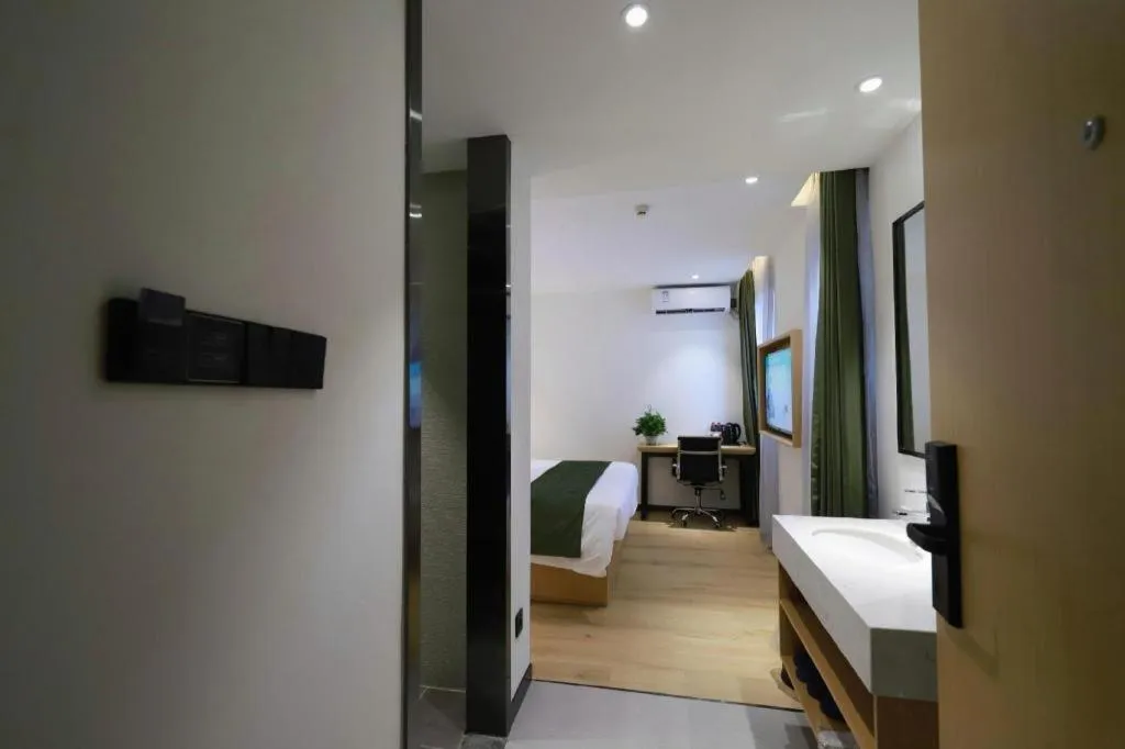 Bed in Green Tree Inn Guangxi Wuzhou 2nd Xinxing Road Liangguang Market