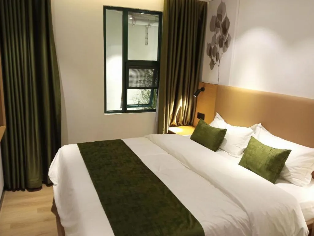 Bed in Green Tree Inn Guangxi Wuzhou 2nd Xinxing Road Liangguang Market