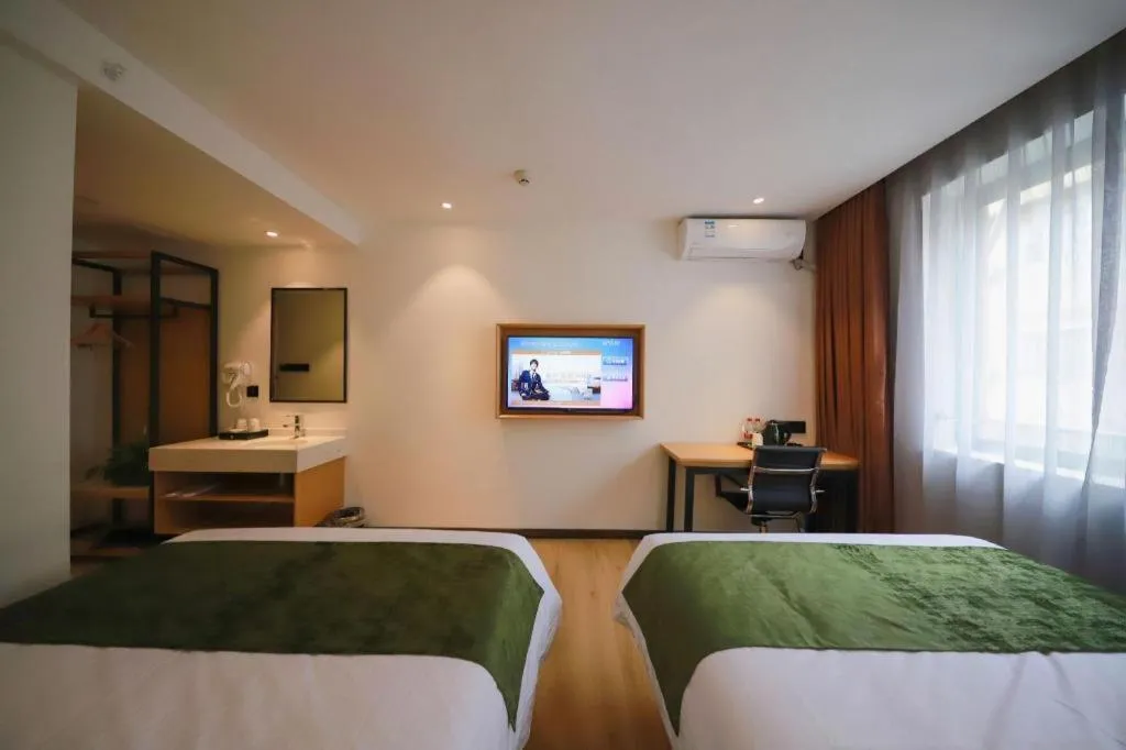 Bed in Green Tree Inn Guangxi Wuzhou 2nd Xinxing Road Liangguang Market