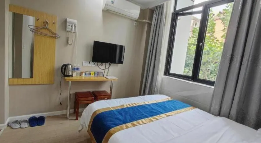 Bed in Shell Hotel Shanghai Normal University Hongcao Road Metro Station Guiping Road