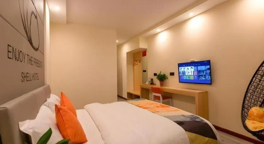 Bed in Shell Hotel Suzhou Zhangjiagang Jingang Town Central Plaza
