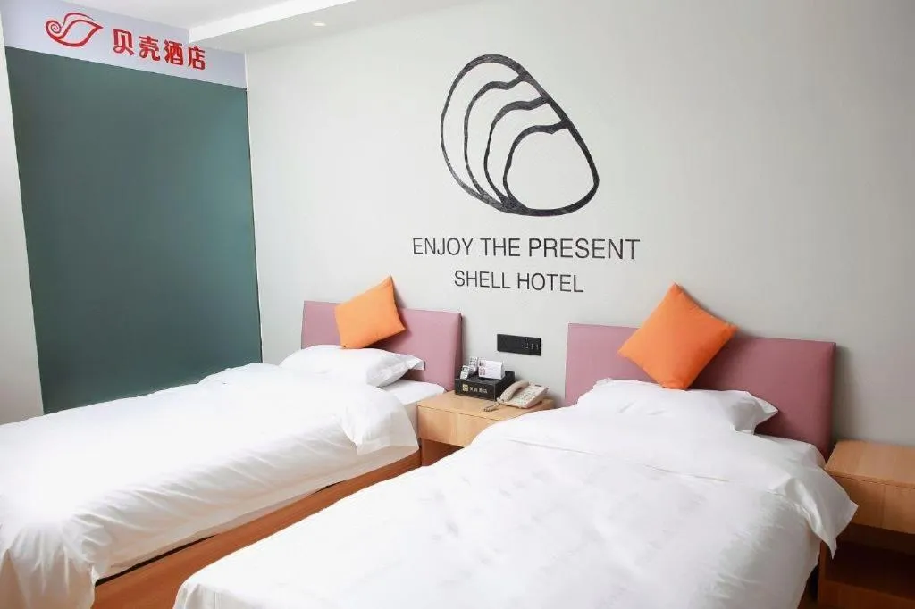 Bed in Shell Hotel Suzhou Zhangjiagang Jingang Town Central Plaza