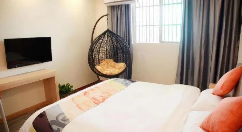 Bed in Shell Hotel Suzhou Zhangjiagang Jingang Town Central Plaza