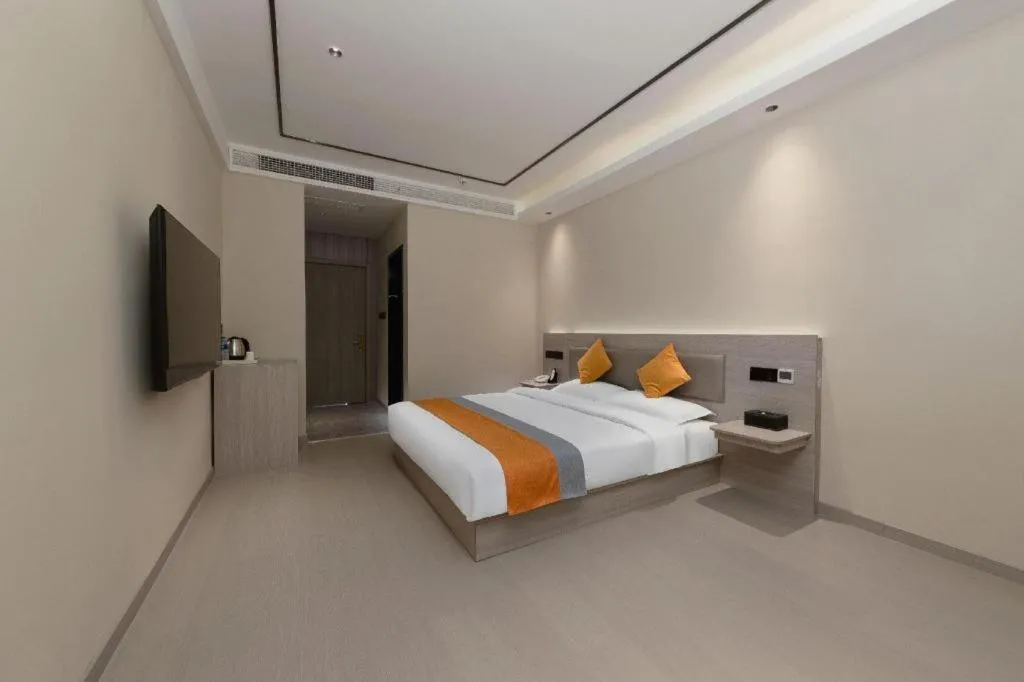 Bed in Shell Hotel Suzhou Zhangjiagang Jingang Town Central Plaza