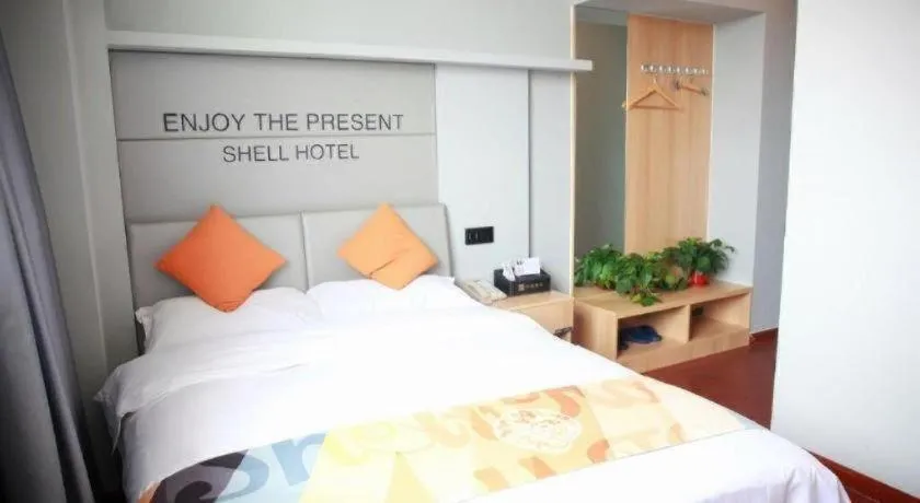 Bed in Shell Hotel Suzhou Zhangjiagang Jingang Town Central Plaza