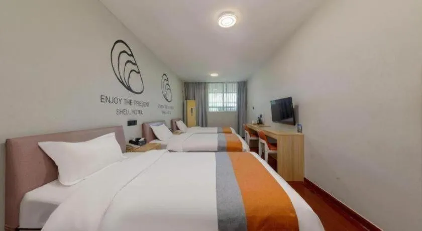 Bed in Shell Hotel Suzhou Zhangjiagang Jingang Town Central Plaza