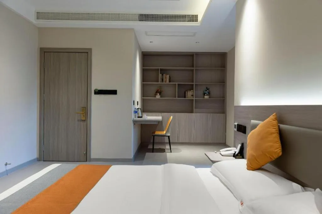 Bed in Shell Hotel Suzhou Zhangjiagang Jingang Town Central Plaza