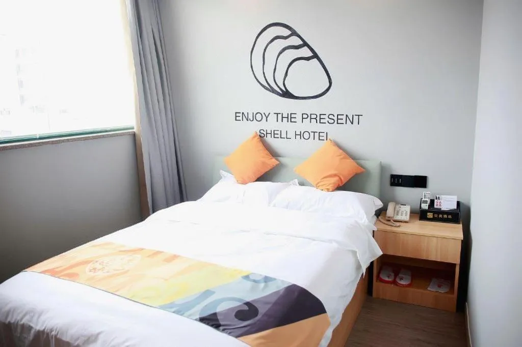 Bed in Shell Hotel Suzhou Zhangjiagang Jingang Town Central Plaza