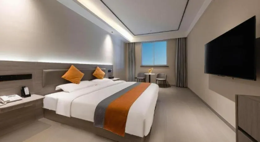 Bed in Shell Hotel Suzhou Zhangjiagang Jingang Town Central Plaza