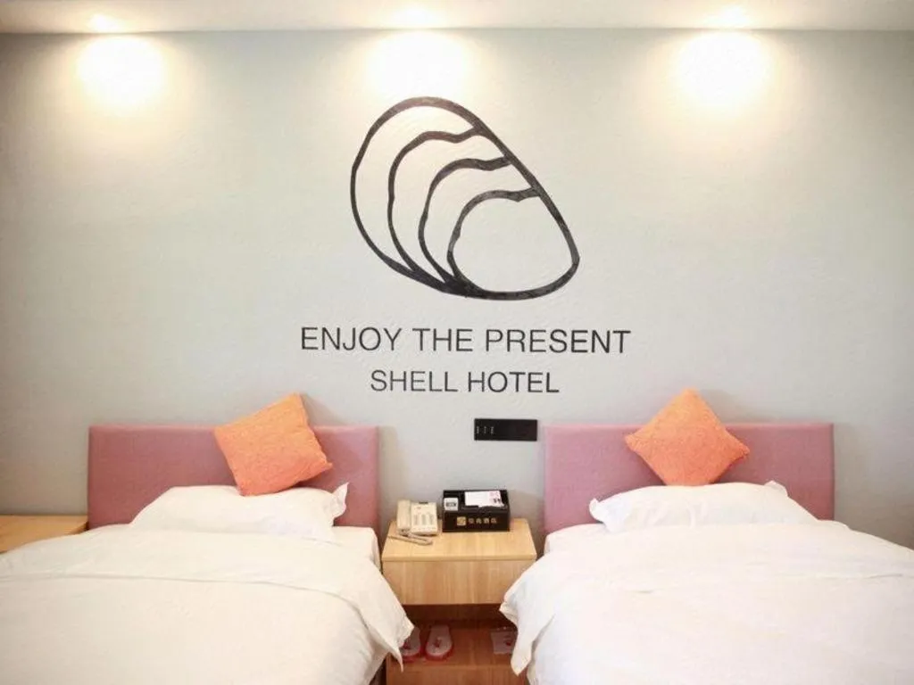 Bed in Shell Hotel Suzhou Zhangjiagang Jingang Town Central Plaza