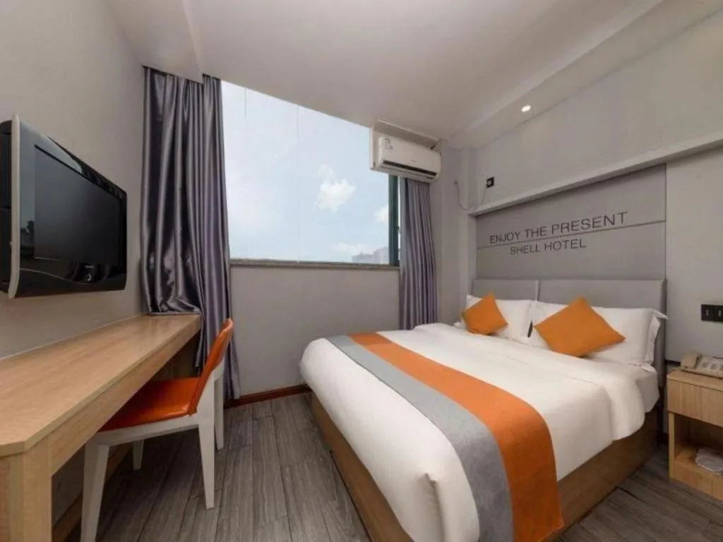 Bed in Shell Hotel Suzhou Zhangjiagang Jingang Town Central Plaza