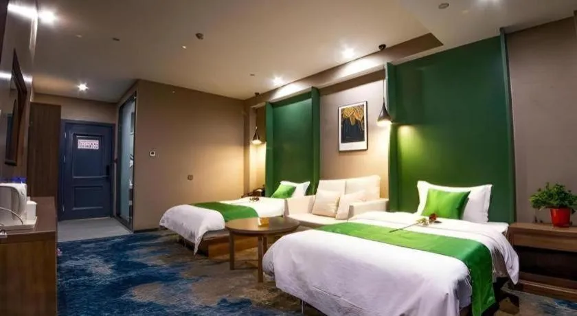 Bed in Shell Hotel Zhengzhou East High-Speed Railway Station Zhengdong Commerical Center