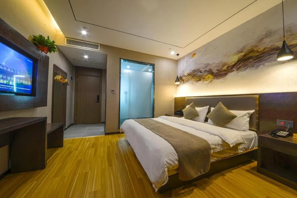 Bed in Shell Hotel Zhengzhou East High-Speed Railway Station Zhengdong Commerical Center