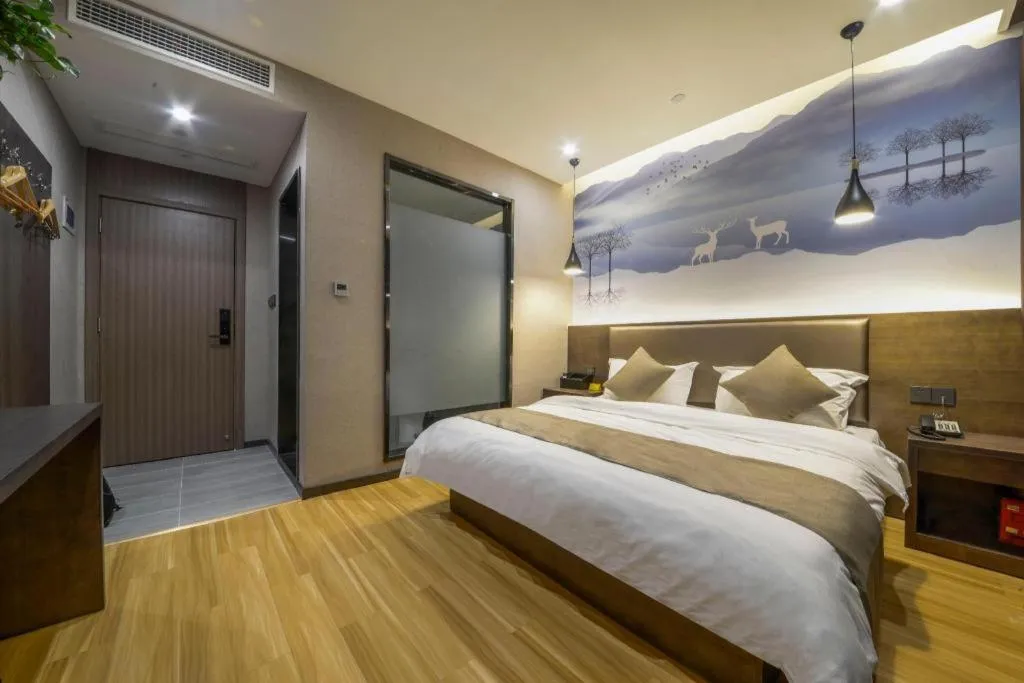 Bed in Shell Hotel Zhengzhou East High-Speed Railway Station Zhengdong Commerical Center