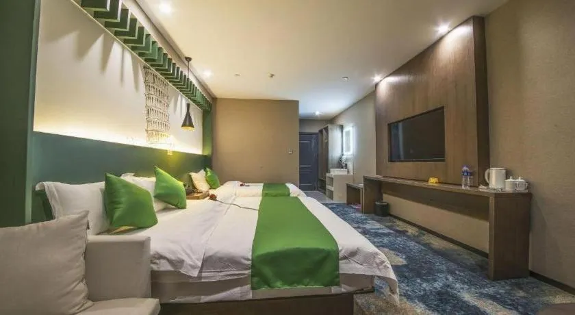 Bed in Shell Hotel Zhengzhou East High-Speed Railway Station Zhengdong Commerical Center