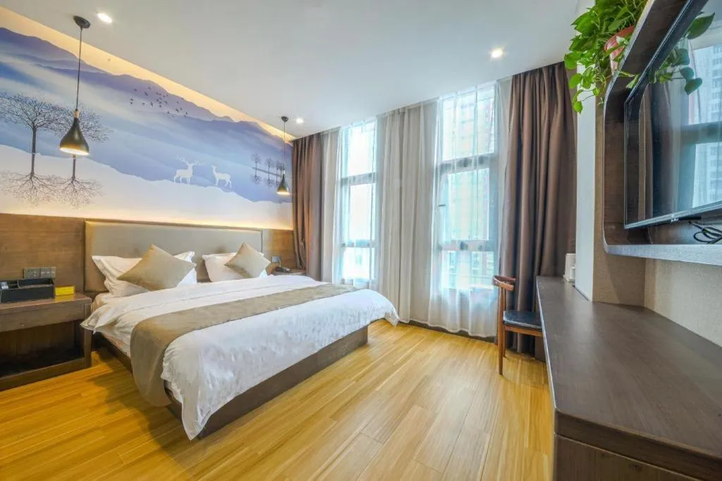 Bed in Shell Hotel Zhengzhou East High-Speed Railway Station Zhengdong Commerical Center