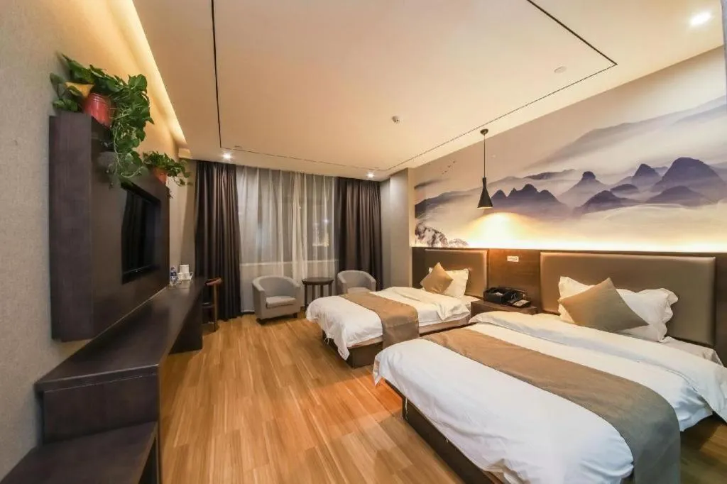 Bed in Shell Hotel Zhengzhou East High-Speed Railway Station Zhengdong Commerical Center