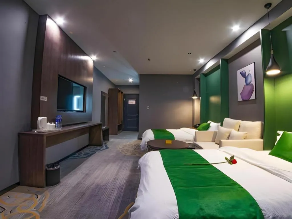 Bed in Shell Hotel Zhengzhou East High-Speed Railway Station Zhengdong Commerical Center