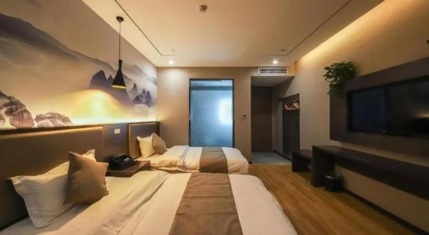 Bed in Shell Hotel Zhengzhou East High-Speed Railway Station Zhengdong Commerical Center