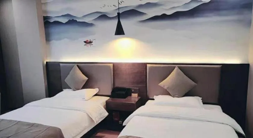 Bed in Shell Hotel Zhengzhou East High-Speed Railway Station Zhengdong Commerical Center