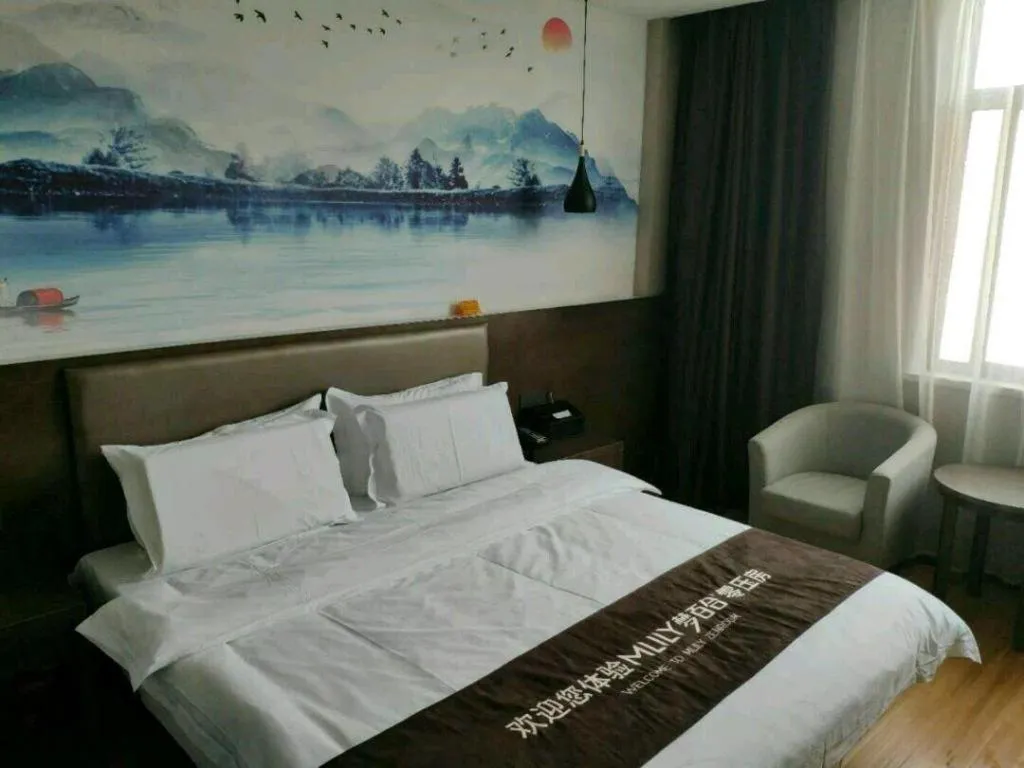 Bed in Shell Hotel Zhengzhou East High-Speed Railway Station Zhengdong Commerical Center