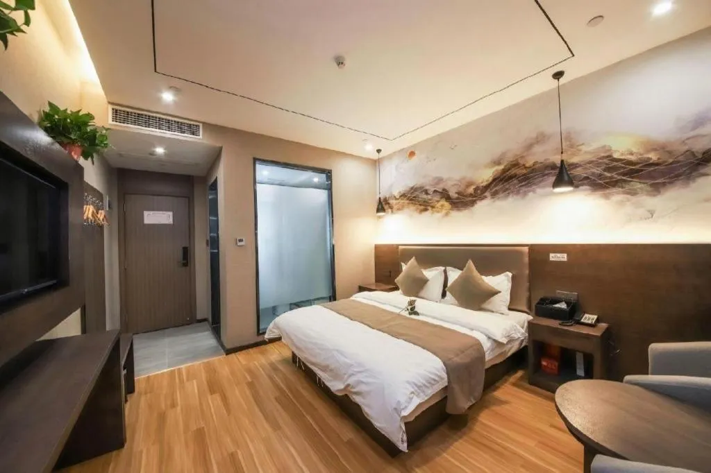 Bed in Shell Hotel Zhengzhou East High-Speed Railway Station Zhengdong Commerical Center