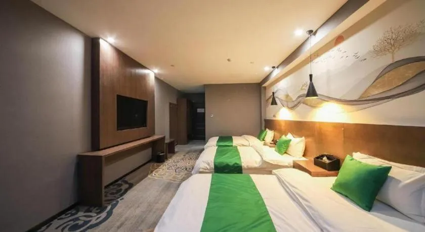 Bed in Shell Hotel Zhengzhou East High-Speed Railway Station Zhengdong Commerical Center