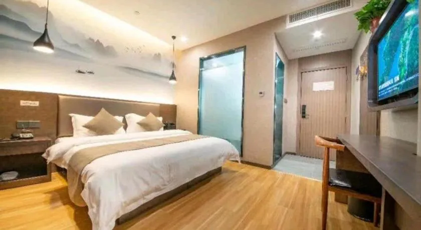 Bed in Shell Hotel Zhengzhou East High-Speed Railway Station Zhengdong Commerical Center