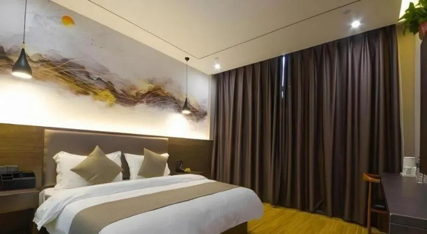Bed in Shell Hotel Zhengzhou East High-Speed Railway Station Zhengdong Commerical Center